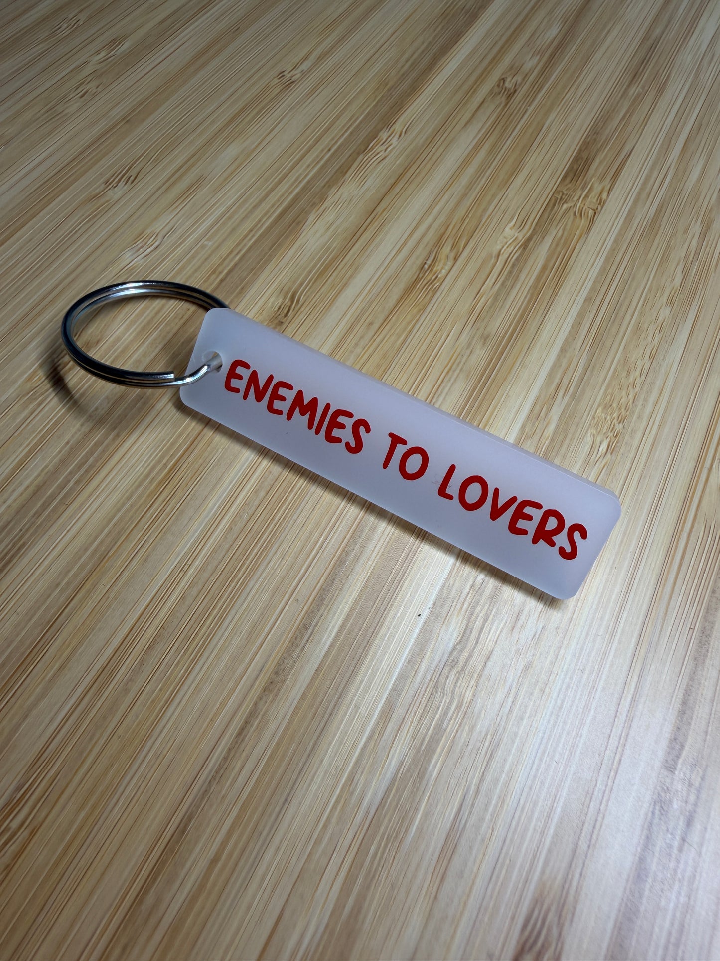 Enemies to Lovers strip style keyring