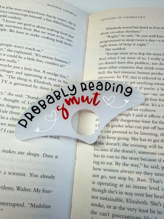 Probably reading smut book holder
