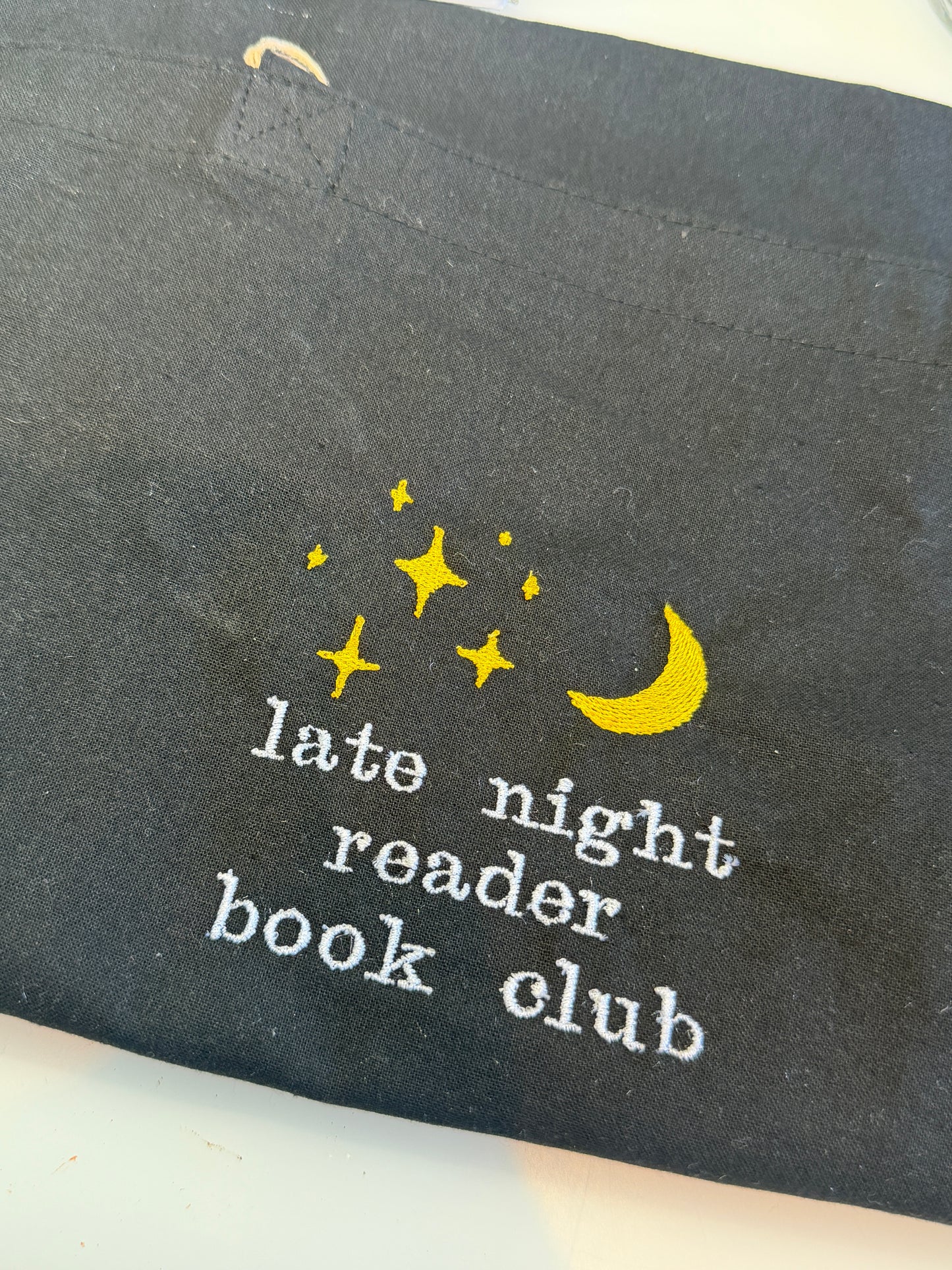 Late night reader tote bag