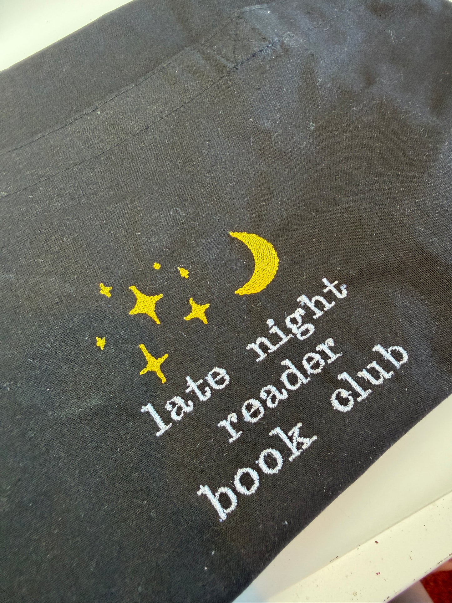 Late night reader tote bag