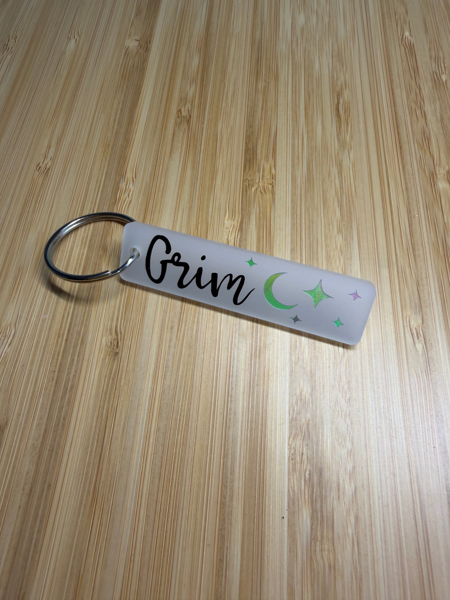 Grim (lightlark) strip style keyring