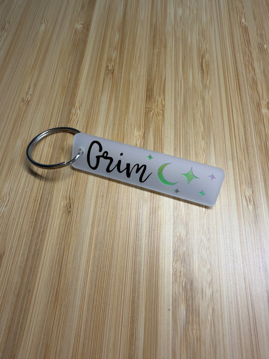 Grim (lightlark) strip style keyring