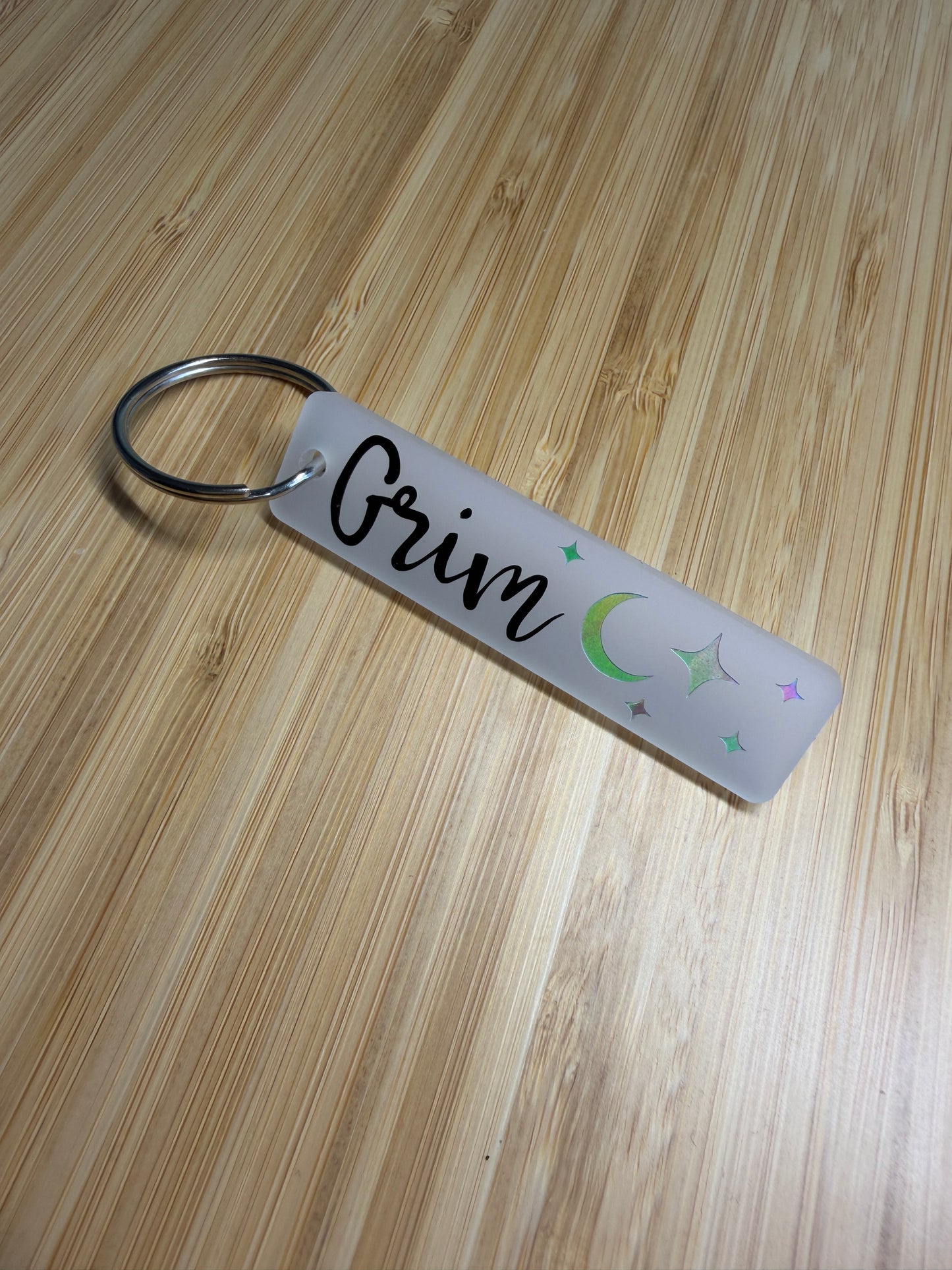 Grim (lightlark) strip style keyring