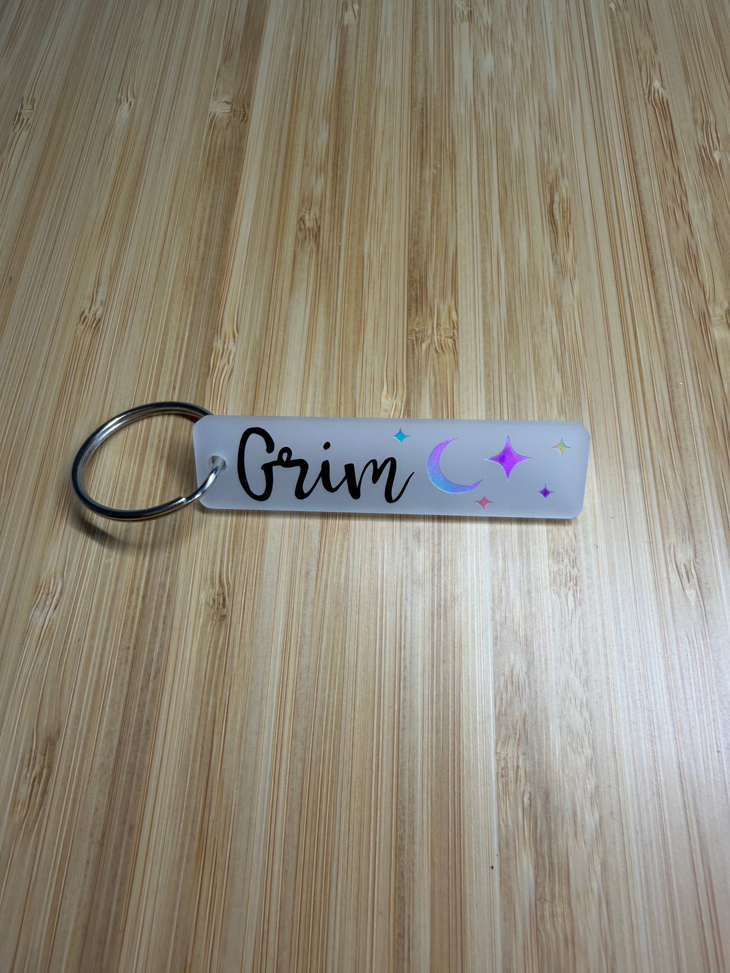 Grim (lightlark) strip style keyring