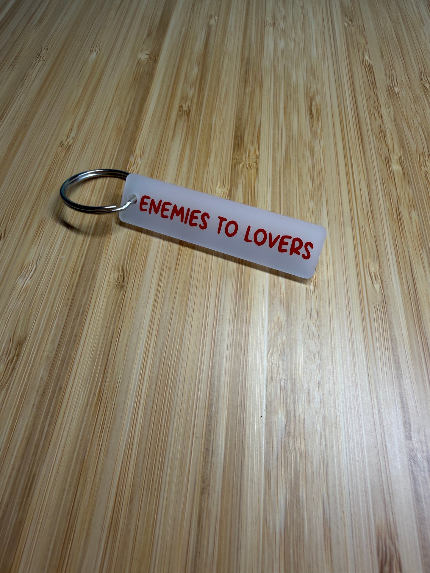 Enemies to Lovers strip style keyring